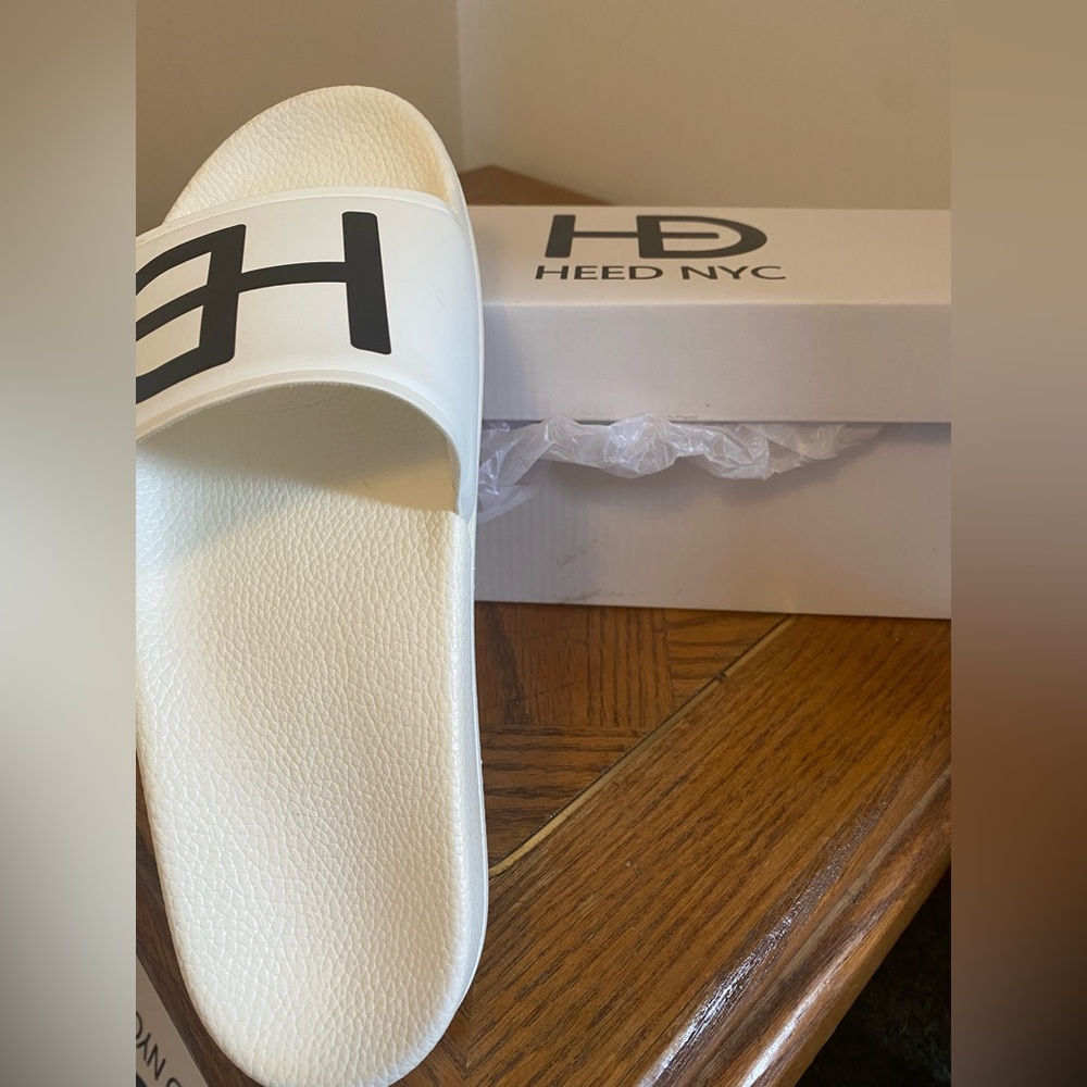 White slides men’s size 42. Never worn.